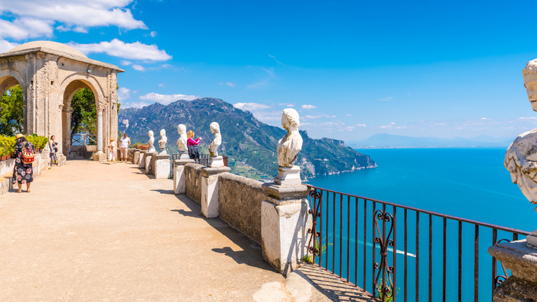 Views over the sea from the Infinity Terrace with marble busts and tourists