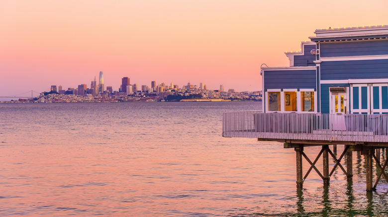 Sausalito house on stilts San Francisco skyline in background