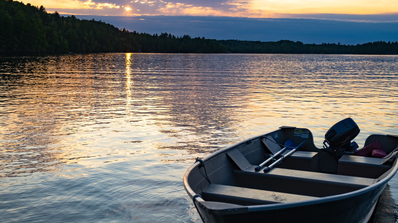 A motorboat rests on a peaceful lake in Voyageurs National Park