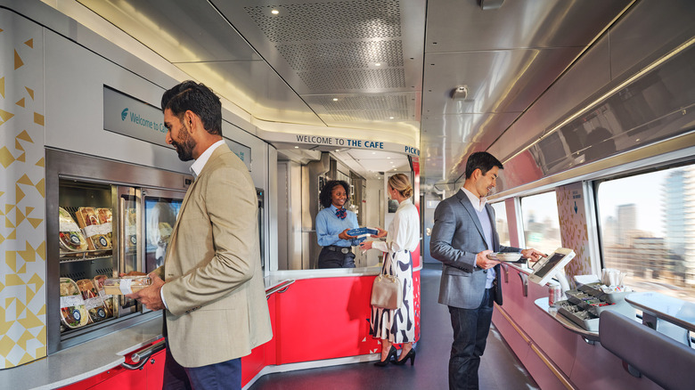 People ordering food in a cafe on a new train