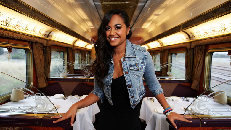 A woman smiles in The Ghan's Queen Adelaide Restaurant