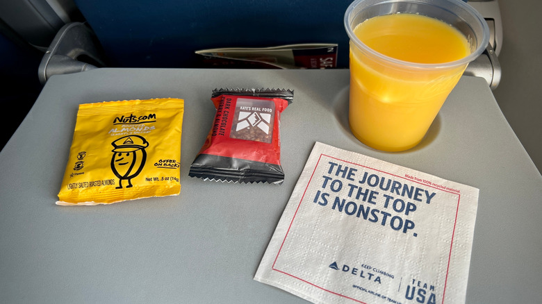 Delta Air Lines snacks on an airplane table.