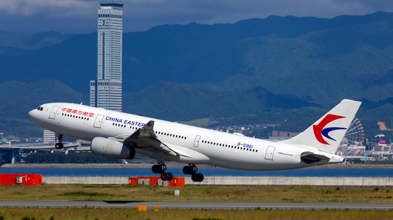 China Eastern Airlines jet taking off from airport runway