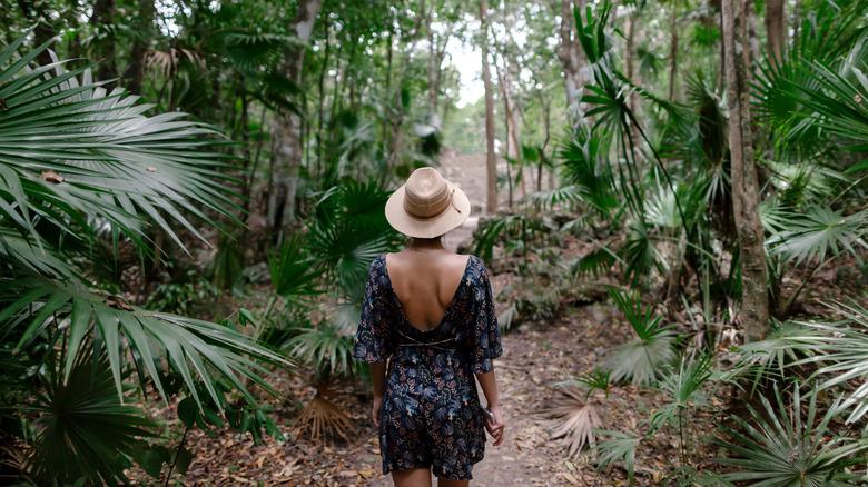 Woman walking through Sian Ka'an Biosphere Reserve