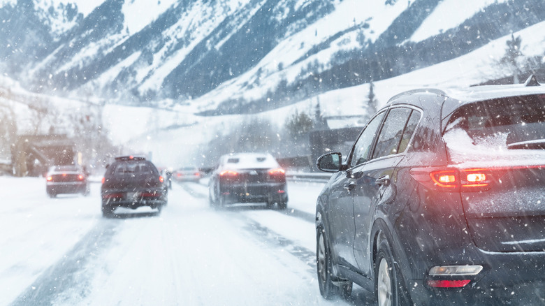 Scenic view cars driving in wintery weather