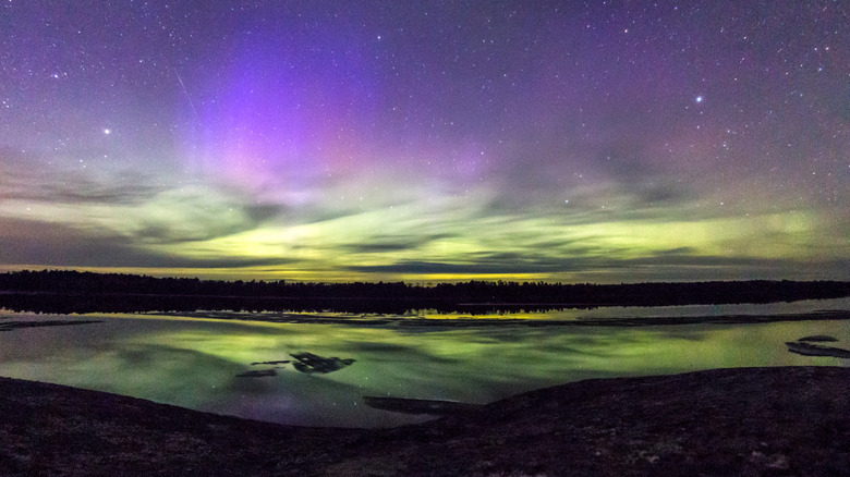 The northern lights appear over the lake at Voyageurs National Park.