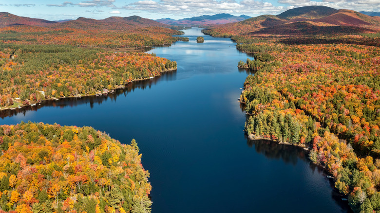 An aerial view of Long Lake in the Adirondacks during fall foliage in Upstate New York