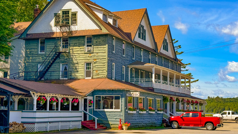 The Adirondack Hotel, a lakefront hotel originally built in the 1950s, on Long Lake in Upstate New York