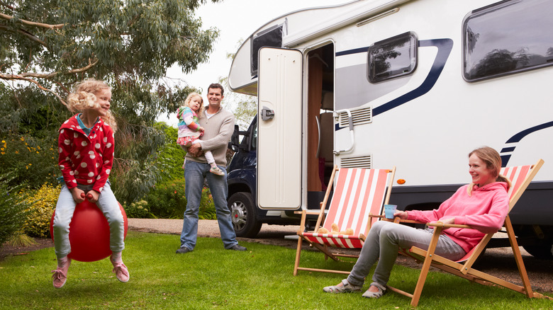family with camper van