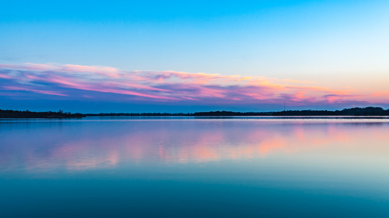 pink and blue sunset scene of Fort Cobb Lake