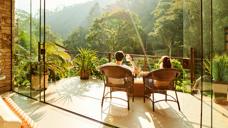 Couple on deck of a tropical hotel