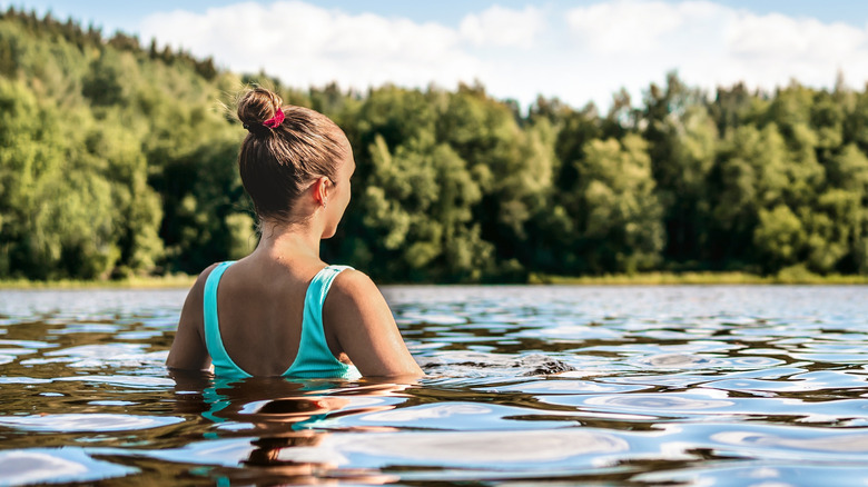 Woman swimming in a lake