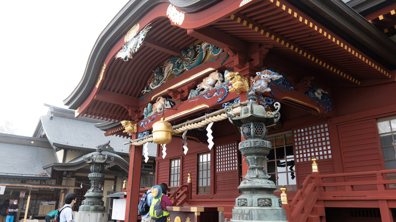 The red and gold face of Musashi Mitake Shrine.