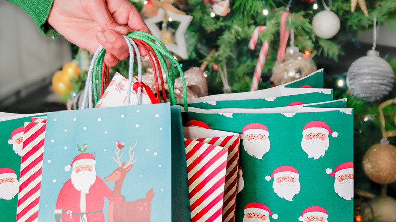 A person carrying gift bags