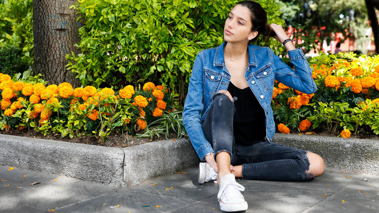 Girl in ripped jeans