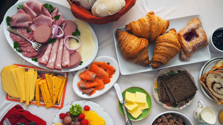 A European breakfast buffet with cold cuts and cheese.