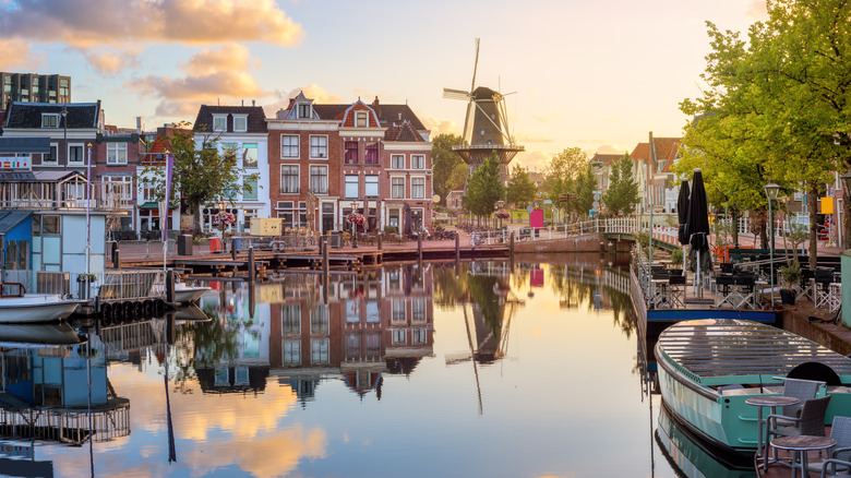 Buildings and a windmill next to the Rhine in Leiden, Netherlands.