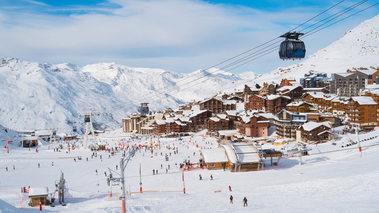 A gondola over a snowy mountain village