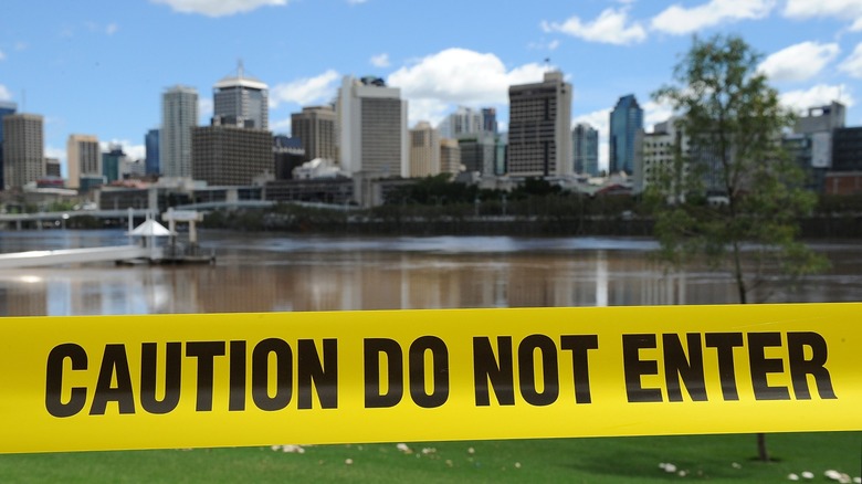Caution tape around Brisbane River