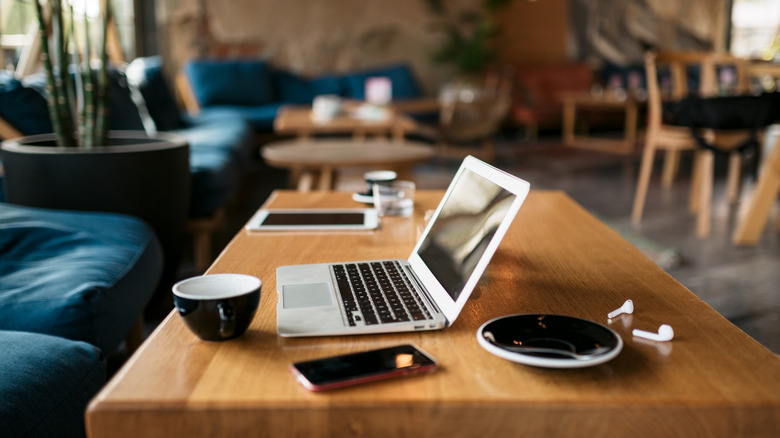 Open laptop on cafe table