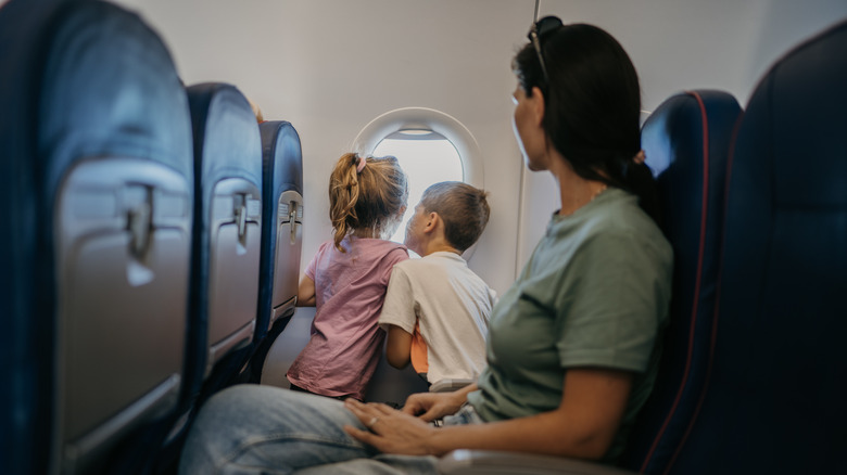 Mother with children on a plane