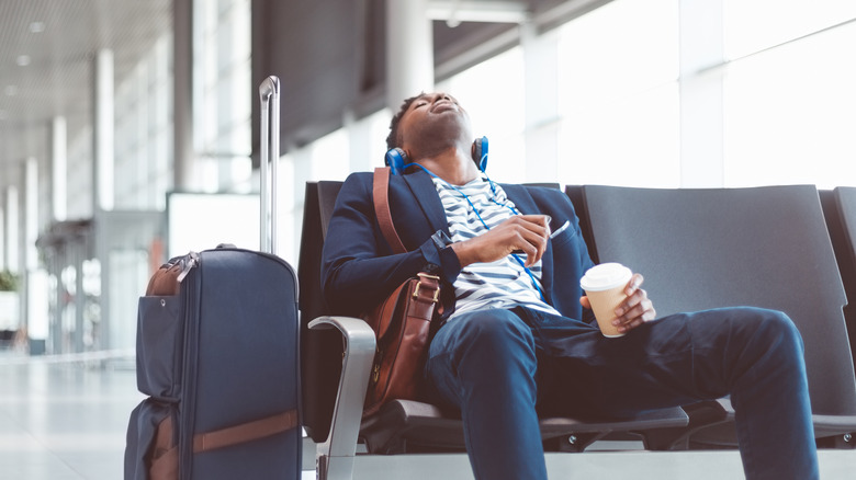 Man sleeps at airport