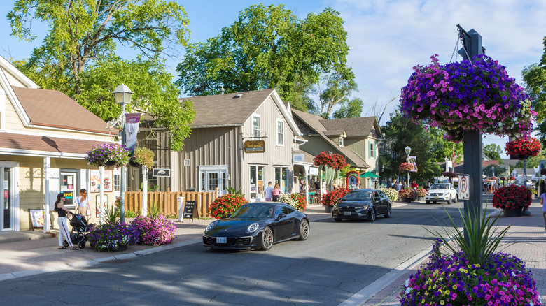 A cute main street with old buildings and flowers