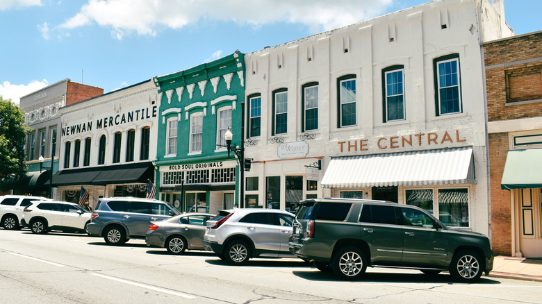 Cars parked in front of Newnan Mercantile buildings, Georgia