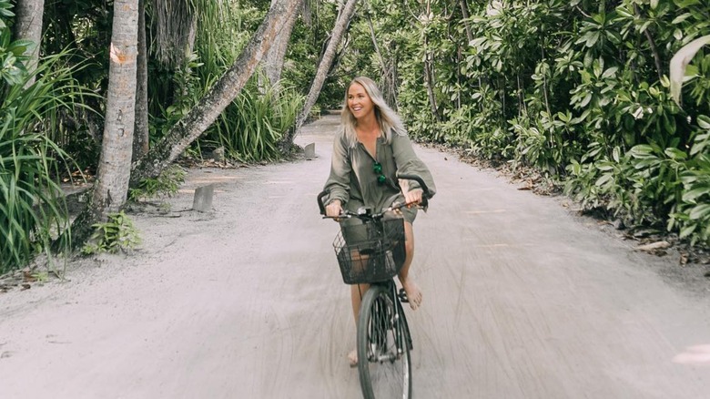woman cycling at Soneva Fushi