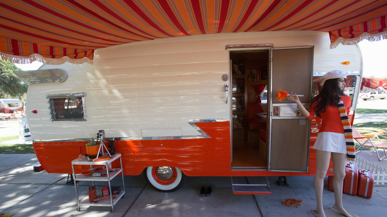 A Shasta campsite set up with a red awning.
