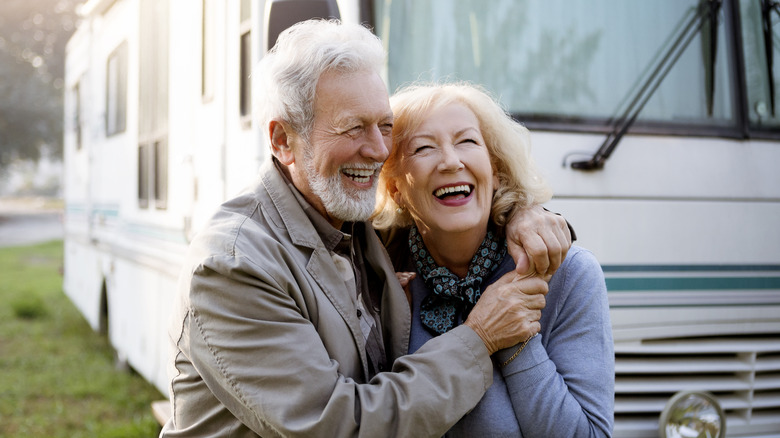 Couple hugging near an RV