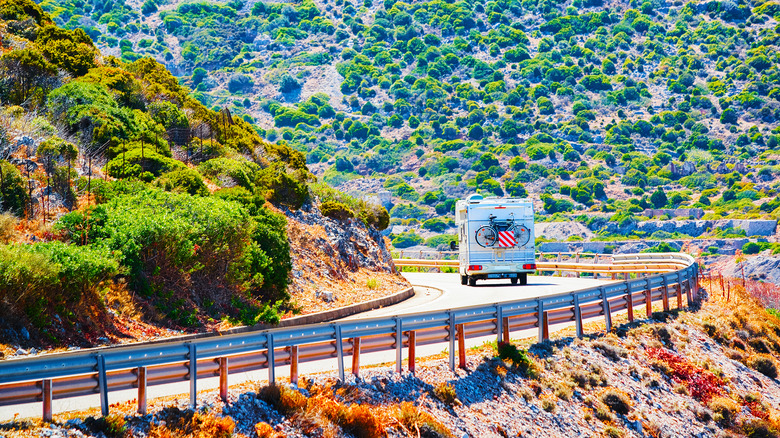 RV on highway in mountains