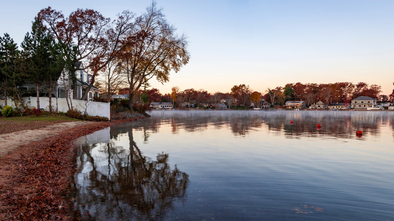 The calm water of Webster Lake during the fall in Webster, Massachusetts.