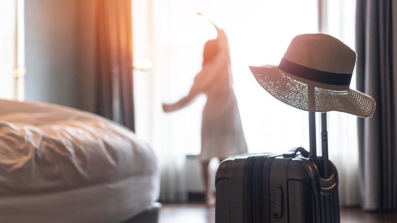 Woman stretching in hotel room