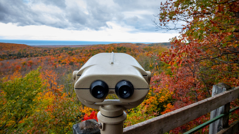 Observation binoculars on a viewpoint tower overlooking the rolling hills in the Porcupine Mountains
