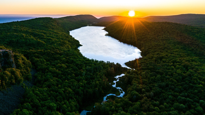 Porcupine Mountains at sunset with rolling hills and Lake of the Clouds
