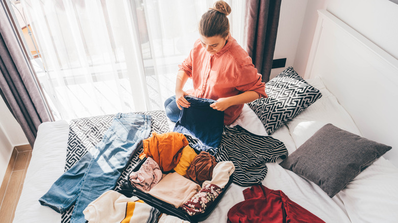 person packing for a trip