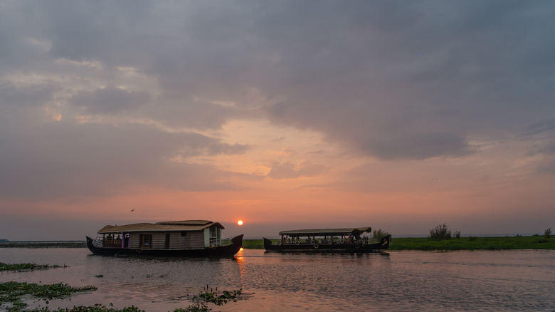 Sunset on Vembanad Lake with houseboats