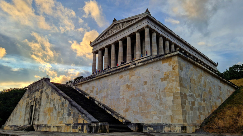 Greek-style temple with columns against a cloudy sky outside Regensburg