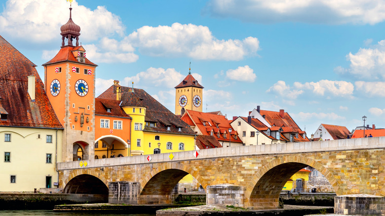 Stone bridge and old city gate with tower in Regensburg in Bavaria