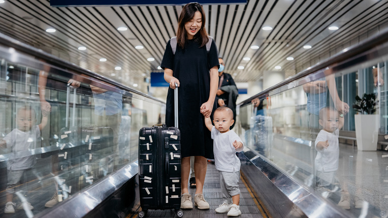 woman with baby at airport