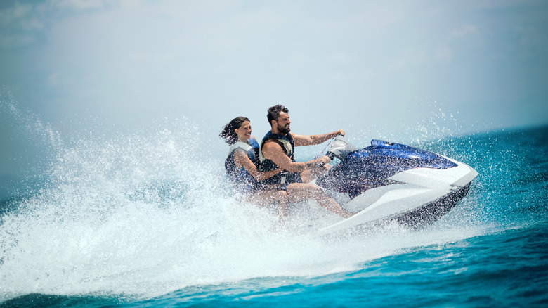 Couple jet skiing