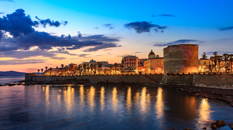 Alghero Italy city scene waterfront at night