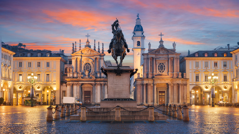 View of Turin Italy's main square with pink sky at sunset