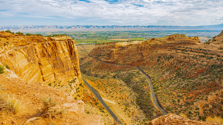 Roads cut in between cliffs and rock formations in a canyon