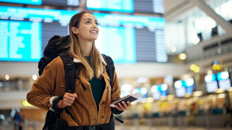 smiling woman at airport