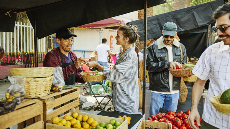 Woman paying at a farmers market
