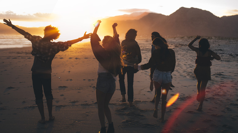 friends running on the beach