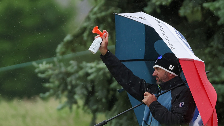 man using air horn