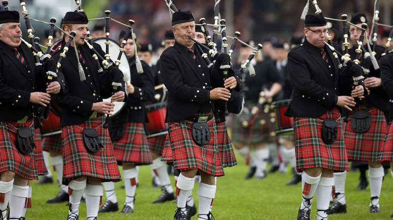 Scottish bagpipers in kilts at the Highland Games.